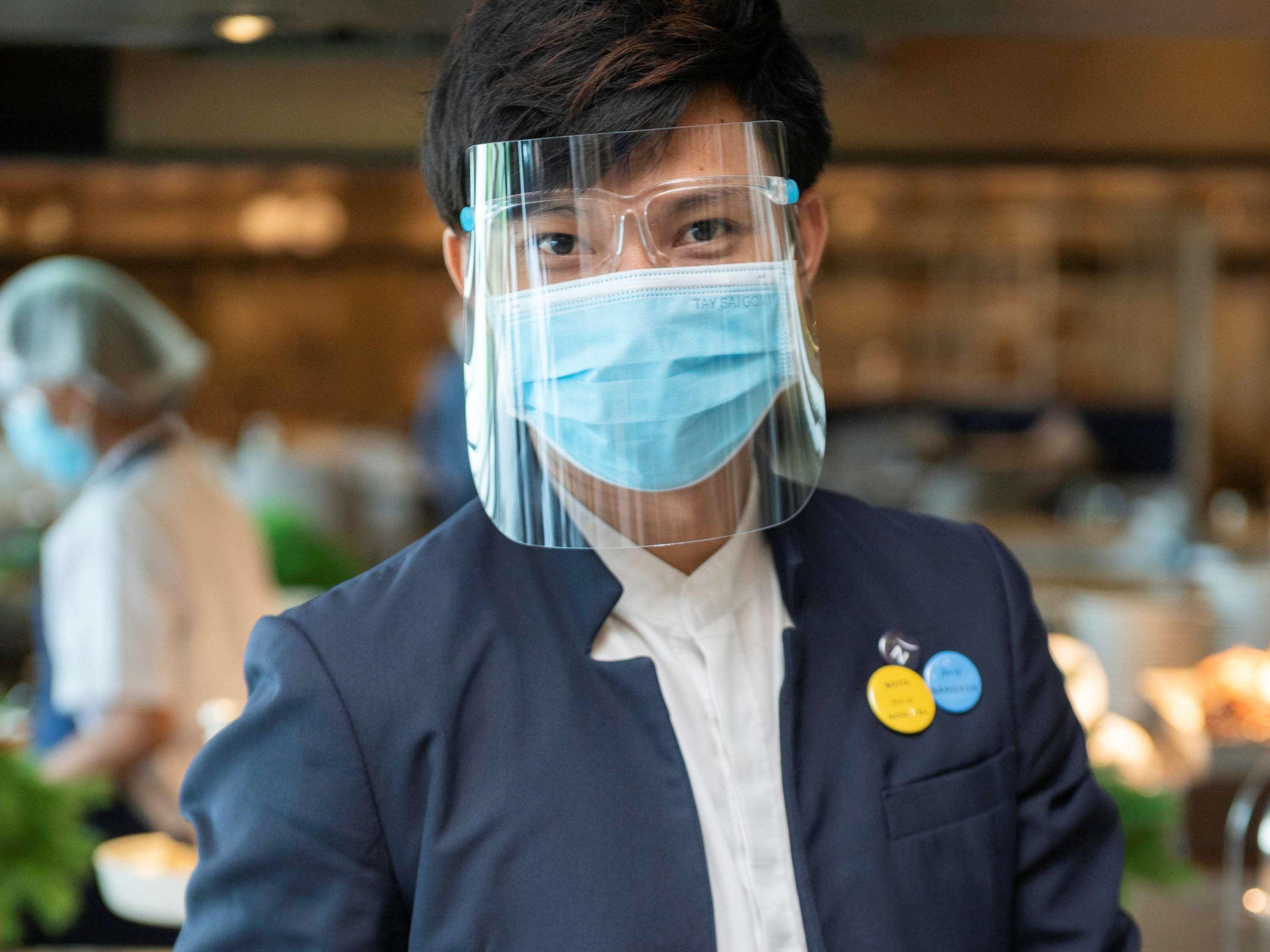 Novotel Chennai Sipcot Εξωτερικό φωτογραφία A Thai Airways employee wearing a face shield