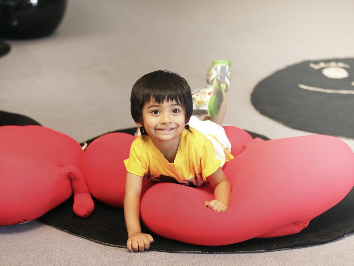 Novotel Chennai Sipcot Εξωτερικό φωτογραφία A child playing with a bean bag